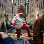 Holiday Madness In Midtown Manhattan   The New York Times Intended For Kiss Under This Christmas Decoration Crossword Clue