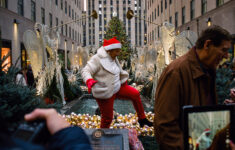 Holiday Madness In Midtown Manhattan – The New York Times intended for Kiss Under This Christmas Decoration Crossword Clue